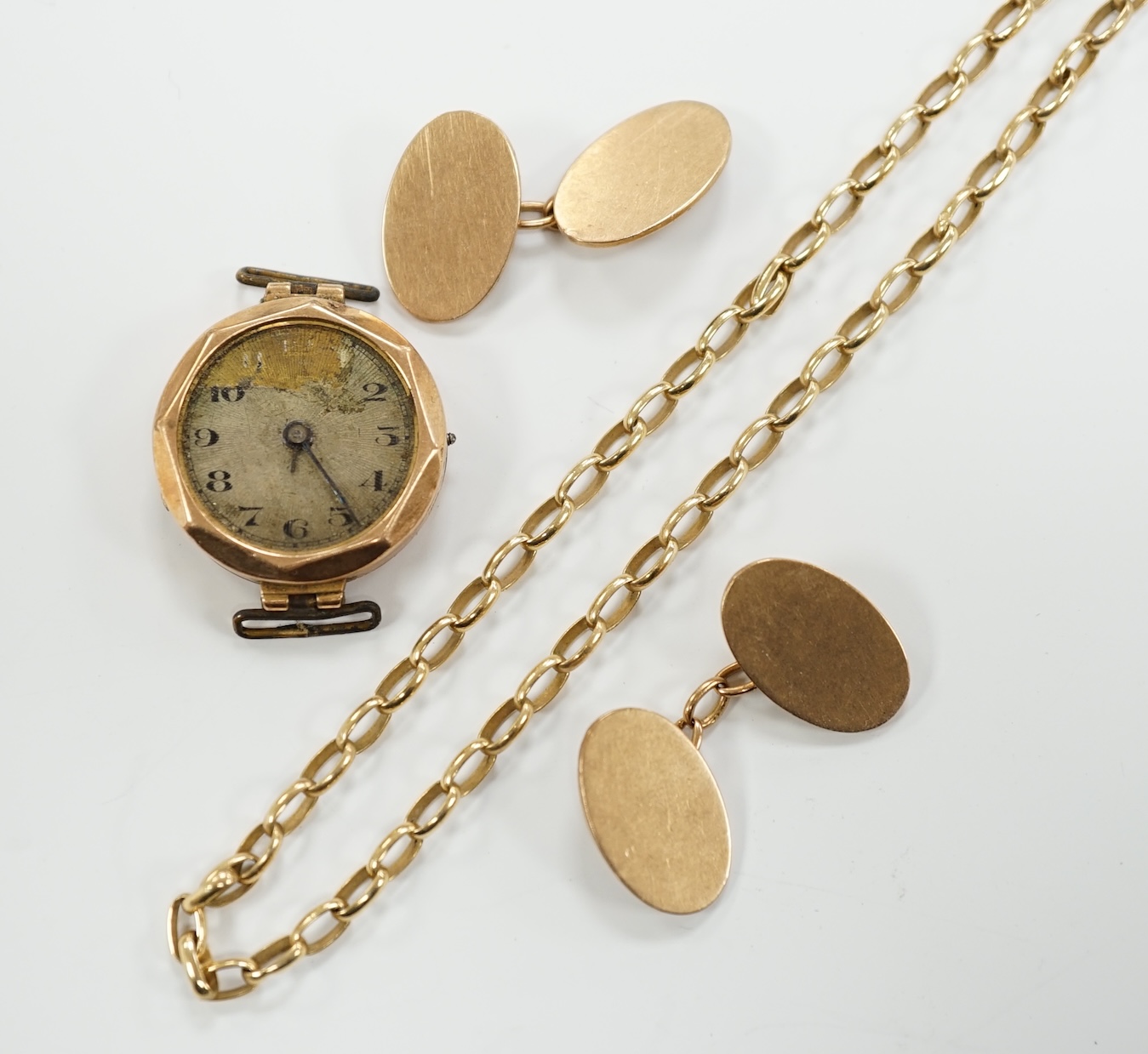 A pair of 9ct gold oval cufflinks, a modern 9ct gold chain, 12.2 grams and a 9ct gold wrist watch (a.f.).